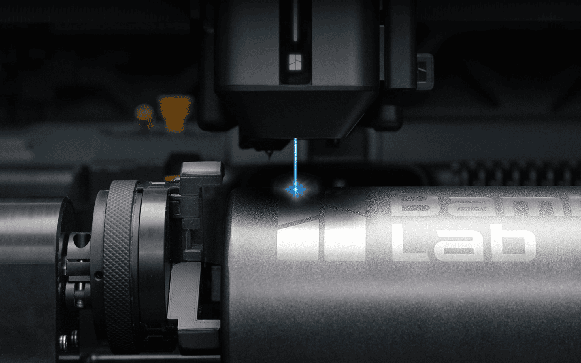 Laser engraving a cylindrical metal component